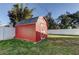 Red storage shed in the backyard at 8495 109Th St, Seminole, FL 33772