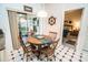 Bright breakfast nook with wood table and chairs, providing casual dining at 905 Oxford Park Dr, Sun City Center, FL 33573