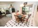 Charming dining area with round wooden table and four chairs at 905 Oxford Park Dr # A, Sun City Center, FL 33573