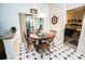 Bright dining area with wooden table and access to a sunroom at 905 Oxford Park Dr # A, Sun City Center, FL 33573