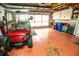 Garage with golf cart, and additional storage space at 905 Oxford Park Dr, Sun City Center, FL 33573