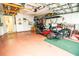 Garage with golf cart, workshop area, and storage at 905 Oxford Park Dr, Sun City Center, FL 33573