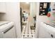 View of kitchen with black appliances and tile floor at 905 Oxford Park Dr, Sun City Center, FL 33573