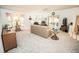 Bright living room featuring a comfy sofa, recliner, and ample natural light at 905 Oxford Park Dr, Sun City Center, FL 33573