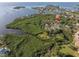 Aerial view of the house and its location on the waterfront at 1580 Mac Chesney Dr, Tarpon Springs, FL 34689