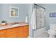 Bathroom with single vanity and shower/tub combo at 1580 Mac Chesney Dr, Tarpon Springs, FL 34689