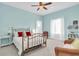 Bedroom with a gold metal bed frame, white bedding, and a cozy atmosphere at 1580 Mac Chesney Dr, Tarpon Springs, FL 34689