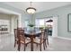 Dining room with large wooden table and access to balcony at 1580 Mac Chesney Dr, Tarpon Springs, FL 34689