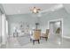 Bright living room with vaulted ceilings, stylish seating, and large windows at 1580 Mac Chesney Dr, Tarpon Springs, FL 34689