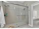 Large walk-in shower with glass enclosure and dual shower heads at 1580 Mac Chesney Dr, Tarpon Springs, FL 34689