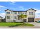 Two-story modern home with a two car garage and manicured lawn at 1954 Iowa Ne Ave, St Petersburg, FL 33703