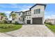 Luxury two story home with paver driveway and palm trees at 1954 Iowa Ne Ave, St Petersburg, FL 33703