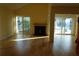 Spacious living room with hardwood floors, a fireplace and beautiful water views at 4108 Pinelake Ln # 102, Tampa, FL 33618