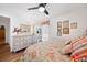 Bedroom featuring a bed, dresser, wood floors, and a fan at 910 Oakwood Dr, Largo, FL 33770