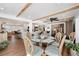 Bright dining area with a glass table, chairs, and a view of the kitchen and living room at 910 Oakwood Dr, Largo, FL 33770