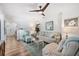 Comfortable living room featuring a calming color palette, patterned accents, and a seamless transition to the foyer at 910 Oakwood Dr, Largo, FL 33770