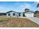 Newly built home with a spacious front yard at 7037 Landover Blvd, Spring Hill, FL 34608