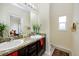 Double vanity bathroom with granite countertop and a window at 7820 Harbor Bridge, New Port Richey, FL 34654