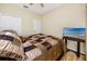 Bedroom with a queen-size bed and flat-screen TV at 7820 Harbor Bridge, New Port Richey, FL 34654