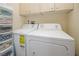 Laundry room with washer, dryer, and ample storage at 7820 Harbor Bridge, New Port Richey, FL 34654