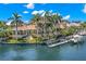 Waterfront estate with private dock, lush landscaping, and beautiful views at 101 12Th E St, Tierra Verde, FL 33715