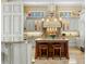 Gourmet kitchen with custom cabinetry, large island, and decorative accents at 101 12Th E St, Tierra Verde, FL 33715