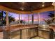 Covered outdoor kitchen with stainless steel appliances and water views at 101 12Th E St, Tierra Verde, FL 33715