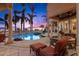 Inviting pool and patio area with comfortable seating and sunset views at 101 12Th E St, Tierra Verde, FL 33715