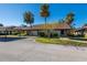 Tan single story home with carport and palm trees at 1340 Powderpuff Dr # 806, Dunedin, FL 34698