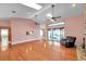 Bright living room with hardwood floors, skylights and a sliding door at 2664 Frisco Dr, Clearwater, FL 33761