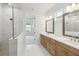 Modern bathroom with double vanity and walk-in shower at 28732 Rambutan Dr, Wesley Chapel, FL 33543