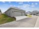 Two-car garage with driveway and street view at 28732 Rambutan Dr, Wesley Chapel, FL 33543