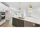 Modern kitchen with white cabinets, stainless steel appliances, and a large island at 28732 Rambutan Dr, Wesley Chapel, FL 33543