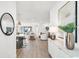 Inviting living space with modern decor, light wood floors, and an open-concept layout perfect for entertaining at 28732 Rambutan Dr, Wesley Chapel, FL 33543