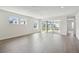 Bright and airy living room with hardwood floors and sliding doors at 28732 Rambutan Dr, Wesley Chapel, FL 33543