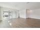 Spacious living room with hardwood floors and access to patio at 28732 Rambutan Dr, Wesley Chapel, FL 33543