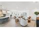 Expansive living area featuring an open layout, modern furnishings, and abundant natural light perfect for relaxation at 28732 Rambutan Dr, Wesley Chapel, FL 33543