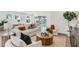 Cozy living area featuring modern furniture, a neutral color palette, and abundant natural light at 28732 Rambutan Dr, Wesley Chapel, FL 33543