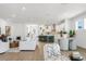Spacious open-concept living space featuring a kitchen, dining, and living area with modern finishes at 28732 Rambutan Dr, Wesley Chapel, FL 33543