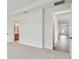Main bedroom with carpet flooring and access to bathroom and hallway at 28732 Rambutan Dr, Wesley Chapel, FL 33543