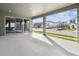 Covered patio with sliding glass doors and view at 28732 Rambutan Dr, Wesley Chapel, FL 33543