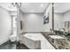 Elegant bathroom with soaking tub, granite counters, and modern fixtures at 815 3Rd S Ave, Tierra Verde, FL 33715