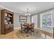 Charming dining room with wooden table, chairs, and built-in hutch at 815 3Rd S Ave, Tierra Verde, FL 33715