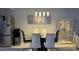 Modern dining room with glass table and lighting at 1243 S Martin Luther King Jr Ave # B205, Clearwater, FL 33756
