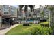 Community pool with lounge chairs and lush landscaping at 1243 S Martin Luther King Jr Ave # B205, Clearwater, FL 33756