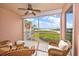 Relaxing balcony with wicker furniture and scenic water view at 13313 Gasparilla Rd # 402, Placida, FL 33946