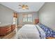 Bright bedroom with water view, king-size bed, and dresser at 13313 Gasparilla Rd # 402, Placida, FL 33946