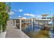 Private boat docks with pathway and multiple boats at 13313 Gasparilla Rd # 402, Placida, FL 33946