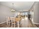 Bright dining area with table and chairs, overlooking living room at 13313 Gasparilla Rd # 402, Placida, FL 33946