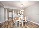 Bright dining room with table and chairs, open to kitchen at 13313 Gasparilla Rd # 402, Placida, FL 33946